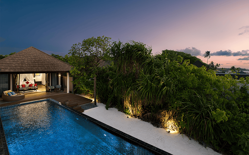 atmosphere kanifushi maldives kanifushi beach villa with pool exterior view front sunset v2
