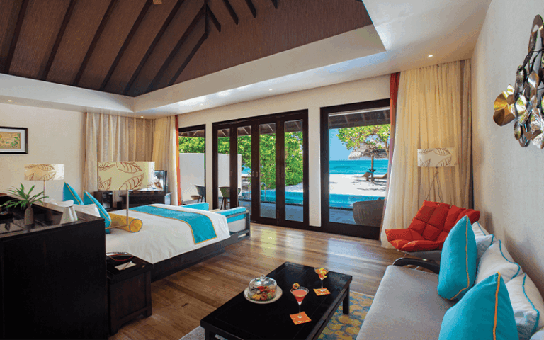 atmosphere kanifushi maldives sunset pool villa interior with view v2