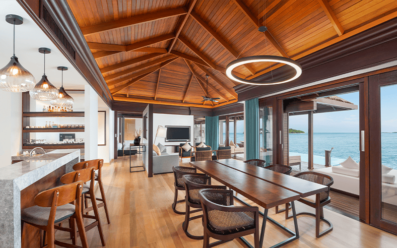 sheraton maldives full moon resort & spa 2 bedroom water villa with pool living room high 01 v2