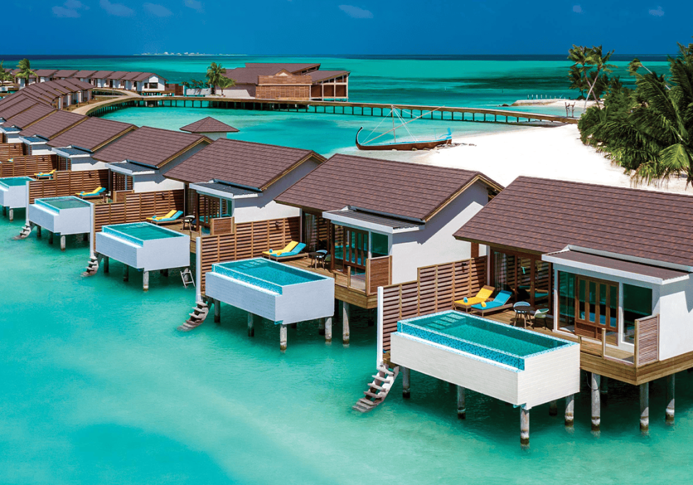 atmosphere kanifushi maldives aerial view water villa jetty 03 v2