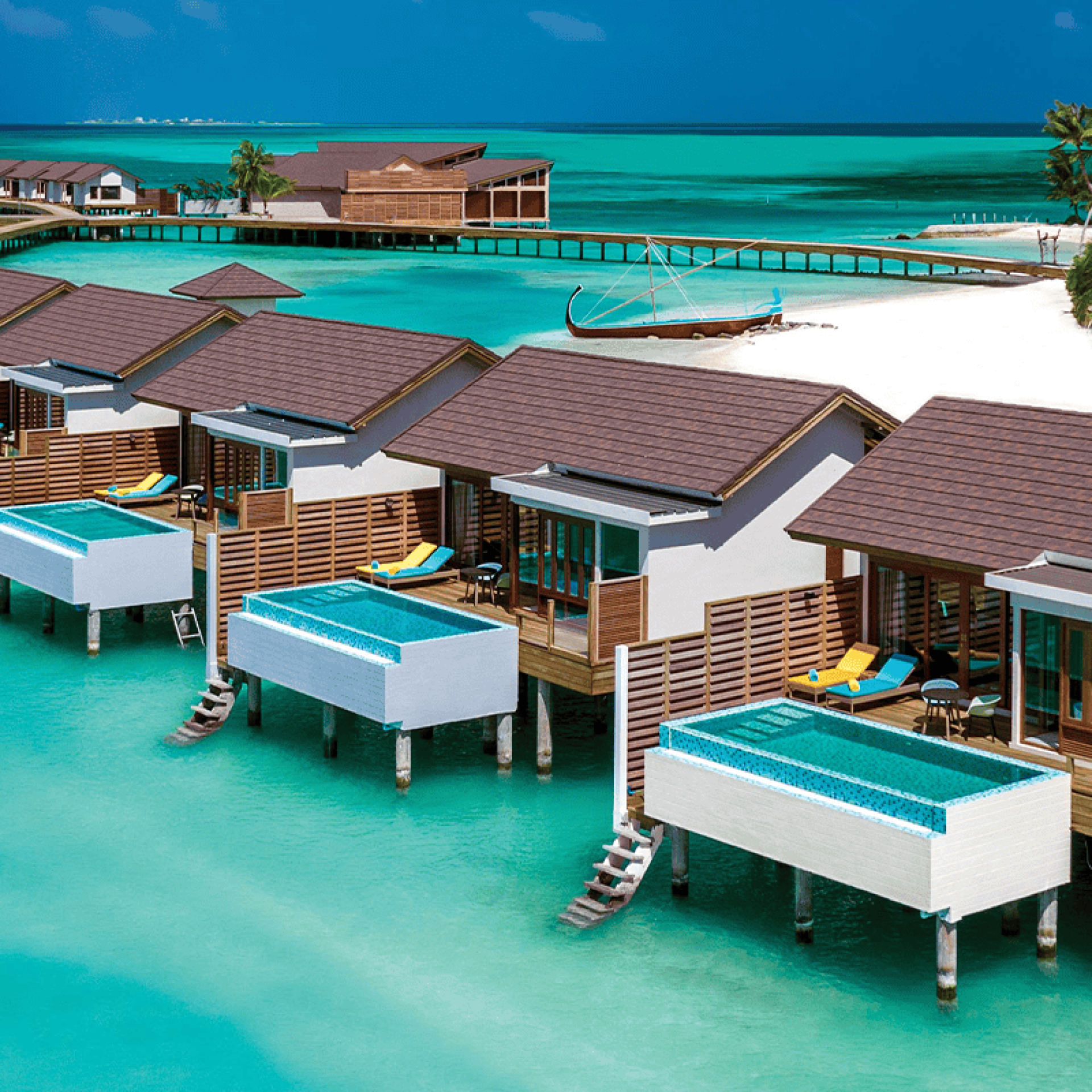 atmosphere kanifushi maldives aerial view water villa jetty 03 v2