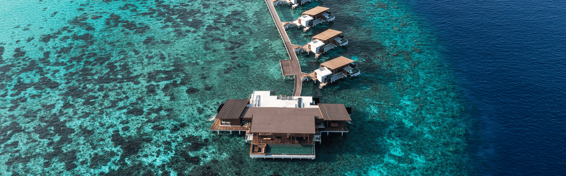 aerial view park hyatt maldives overwater reef residence compressed