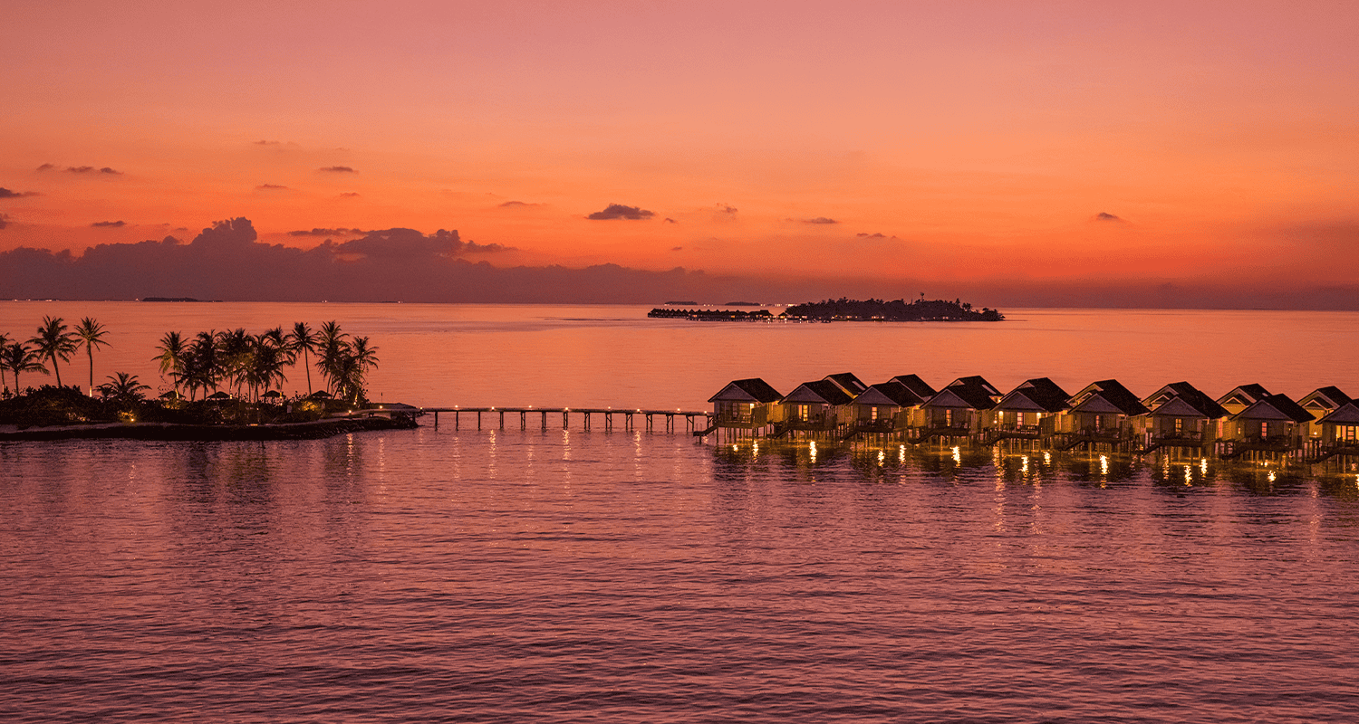 oblu select lobigili island aerial sunset nest water villa 02 compressed