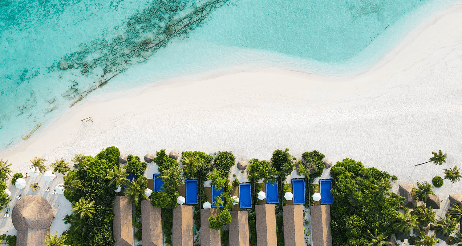 Reethi Faru Resort pool villas aerial compressed